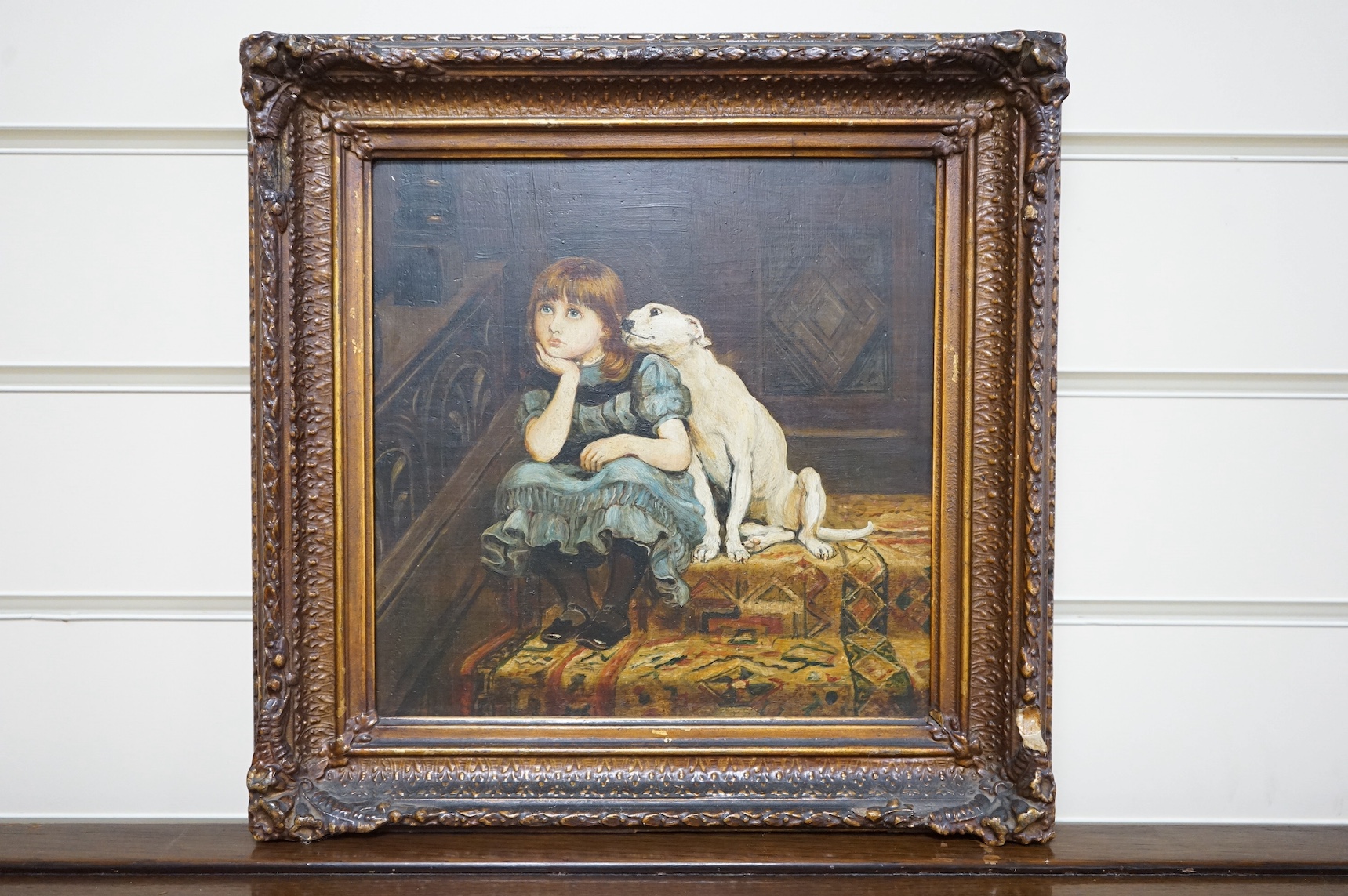 19th century, English School, oil on panel, Seated girl and dog on a stair landing, 22 x 22cm. Condition - good, some losses to the frame